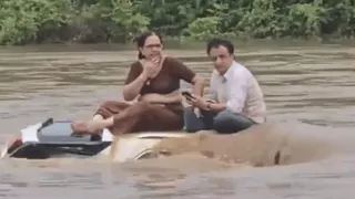 Gujarat Couple Waits On Submerged Car Roof To Get Rescued; Internet Says ‘Too Chilled For Live Or Die Situation’
